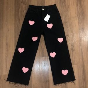 Black wide leg jeans with pink hearts